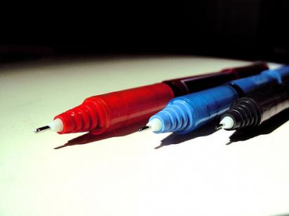 red, blue, and black pens