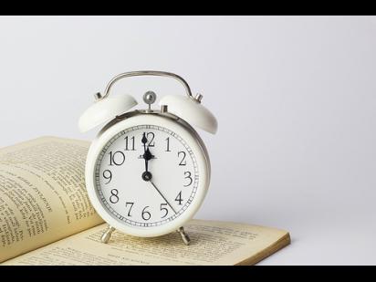 Alarm clock on a book