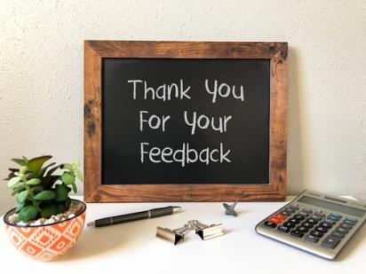 chalkboard with thank for your feedback written on it