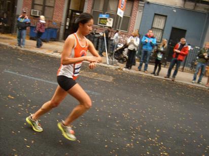 a marathon runner checks her watch