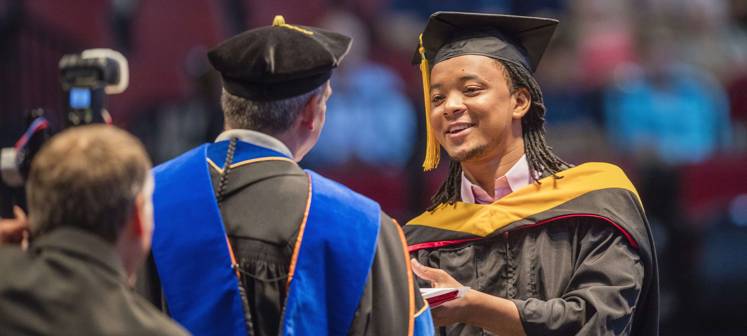 Student receiving diploma at graduation.