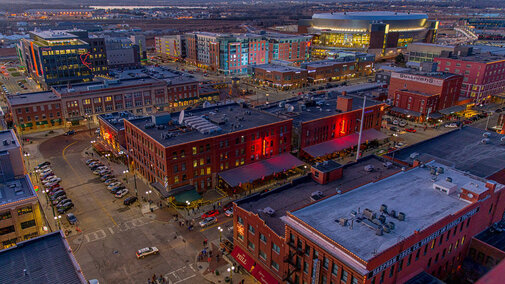 Haymarket area of Lincoln at night with lights lit up