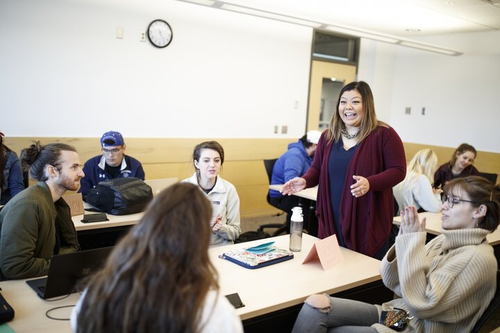 CoJMC professor speaking with students