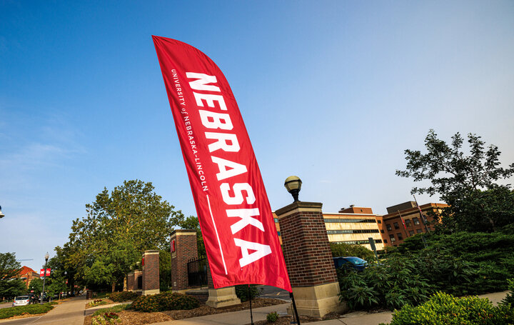 University of Nebraska - Lincoln banner displayed in front of the Union on a sunny day