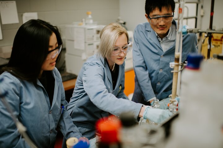 Three graduate students working together